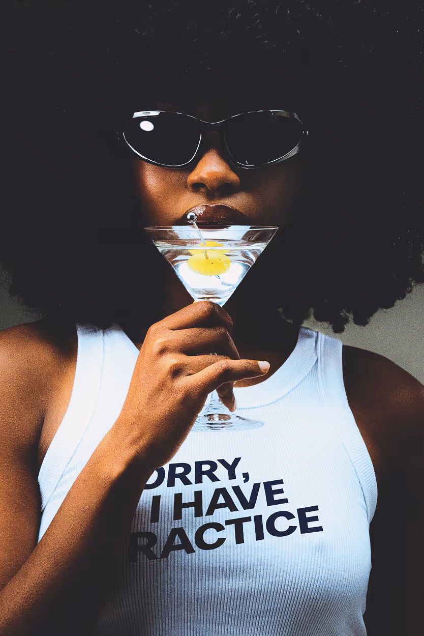 Edited picture of a woman's white tank top with added branded tagline saying "sorry, I have practice." Found on Death to Stock "FIRST ROUND" shot by JELLY LUISE