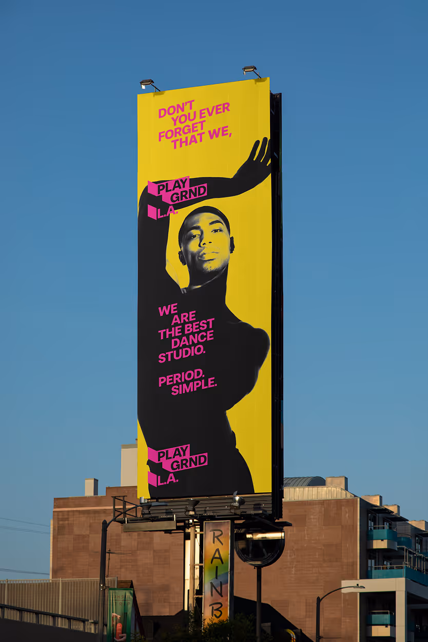 Vertical L.A. Highway Ad Tagline : Don't you ever forget that we, playground L.A., we are the best dance studio. Pink typography, shadowed dancer and bright yellow background. Source : Mockup Maison.